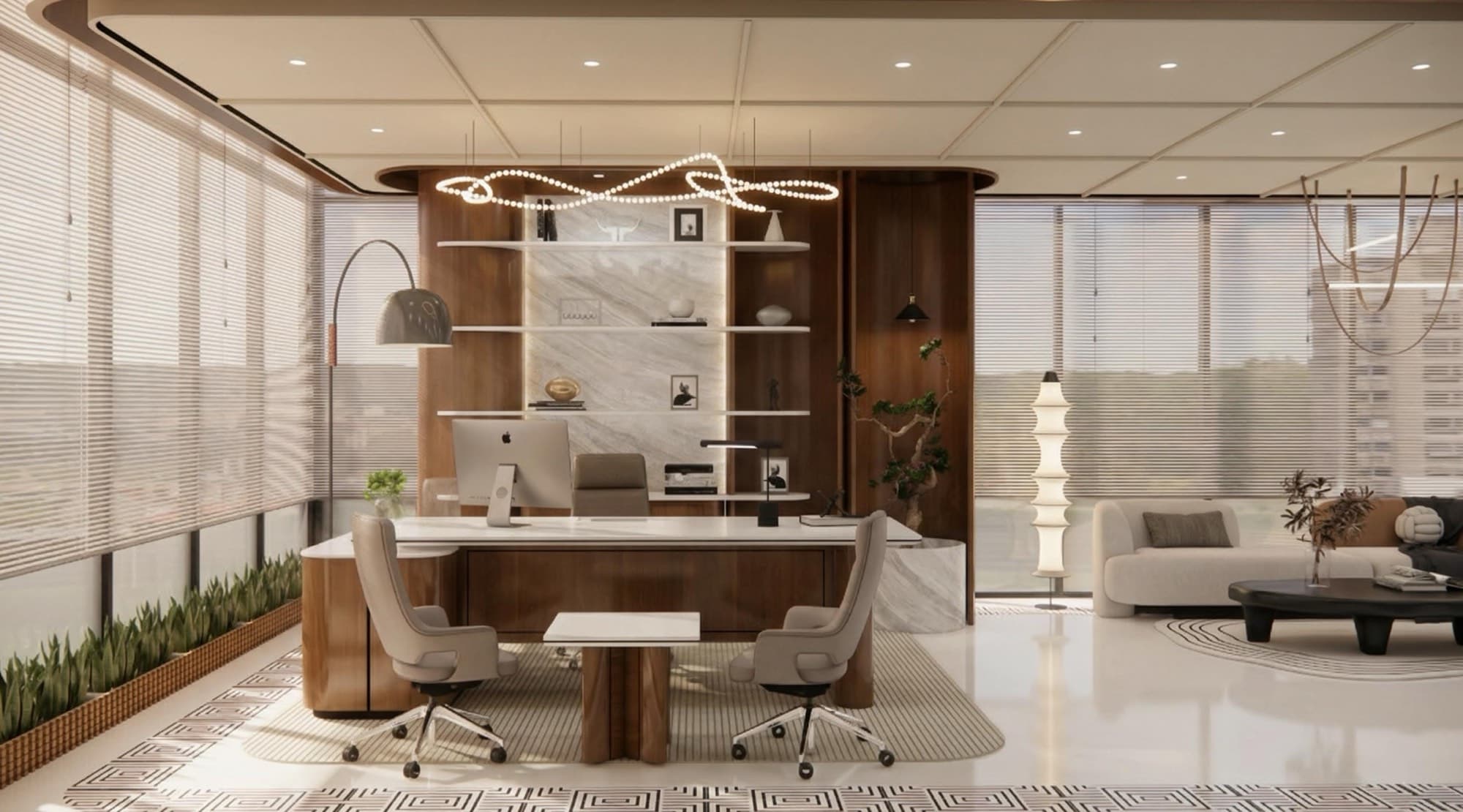 CEO cabin with a walnut and marble backdrop behind the desk and a lounge with curved sofa