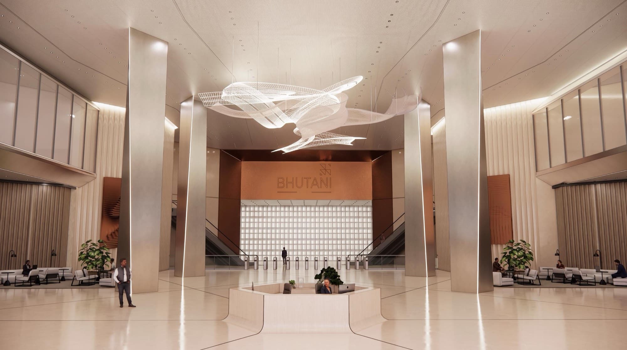 Double-height lobby with tall columns, polished floor and a suspended sculpture above the Bhutani reception wall